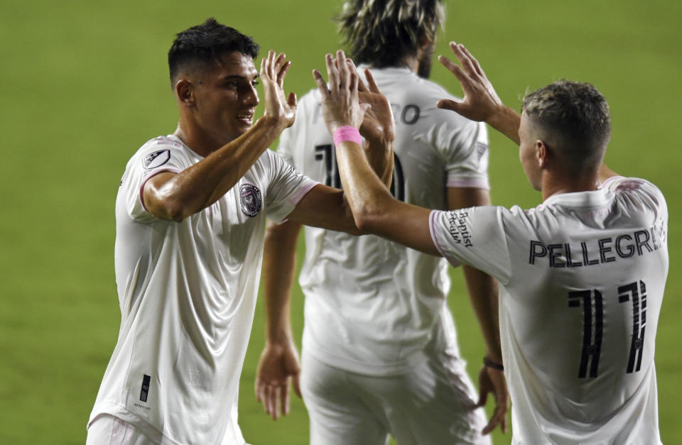 Inter Miami forward Julian Carranza, left, is congratulated by Matias Pellegrini (11) after scoring a second goal against Orlando City during the first half of an MLS soccer match Saturday, Aug. 22, 2020, in Fort Lauderdale, Fla. (AP Photo/Jim Rassol)