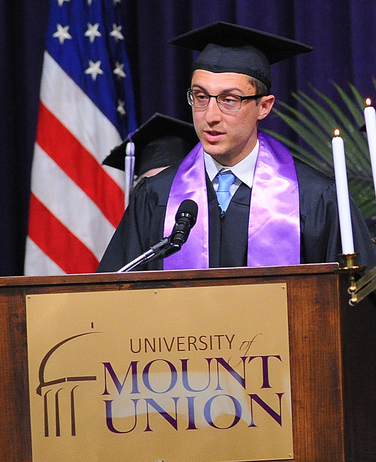 Interim University Chaplain Stephen Dages reads the Gospel of Luke, 10:25-37, during the 176th Baccalaureate Ceremony on May 13, 2022, at the University of Mount Union.