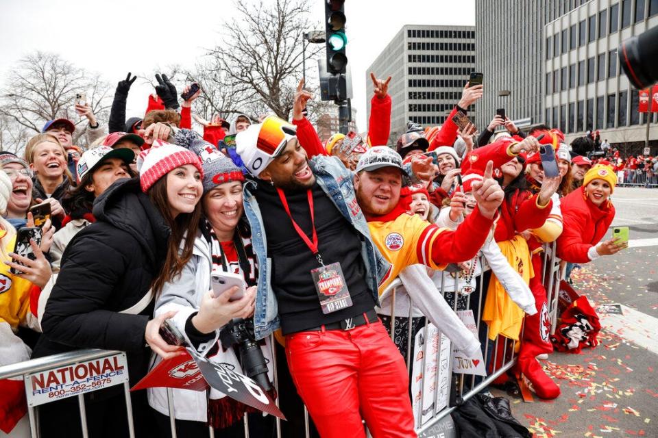 Kansas City Chiefs safety Juan Thornhill celebrates with fans during a victory celebration and parade in Kansas City, Mo., Wednesday, Feb. 15, 2023, following the Chiefs' win over the Philadelphia Eagles Sunday in the NFL Super Bowl 57 football game. (AP Photo/Colin E. Braley)