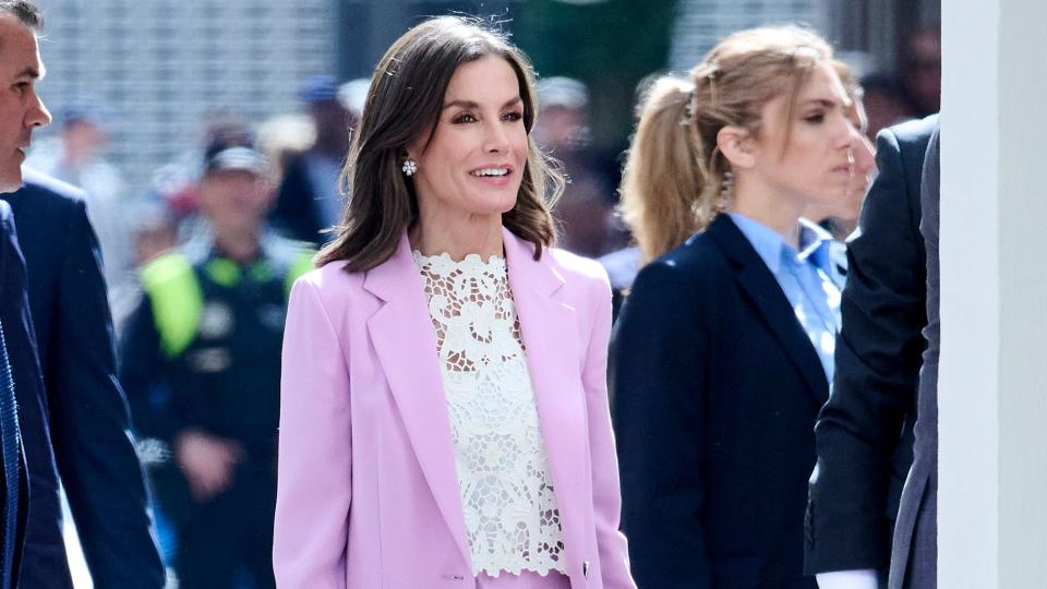 Letizia smiling in lilac suit and white top