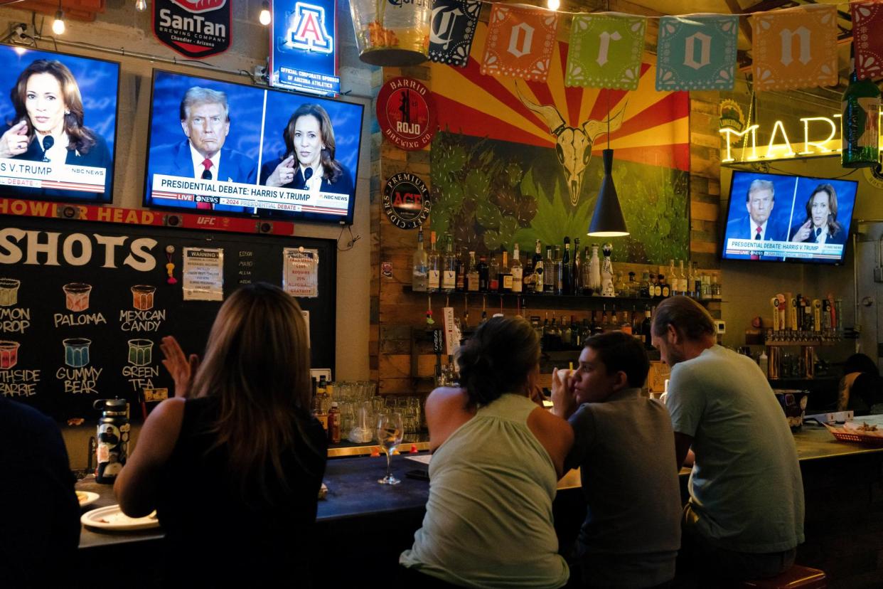 <span>People watch the debate between Kamala Harris and Donald Trump at a restaurant in Tucson, Arizona, on 10 September 2024.</span><span>Photograph: Rebecca Noble/AFP/Getty Images</span>