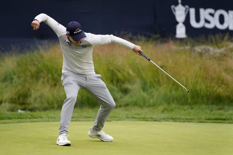 Matthew Fitzpatrick, of England, reacts after a putt on the 13th hole during the final round of the U.S. Open golf tournament at The Country Club, Sunday, June 19, 2022, in Brookline, Mass. (AP Photo/Julio Cortez)