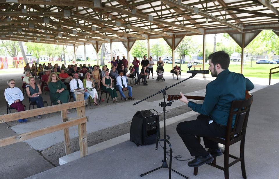 Ian Hiatt, brother of Jessica Hiatt, sings a song during her celebration of life service Monday, May 16, 2022, in Slater, Iowa.