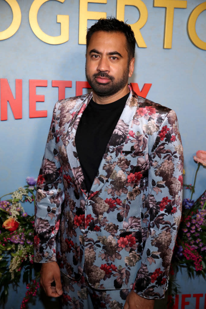 close up of Kal wearing a floral print suit