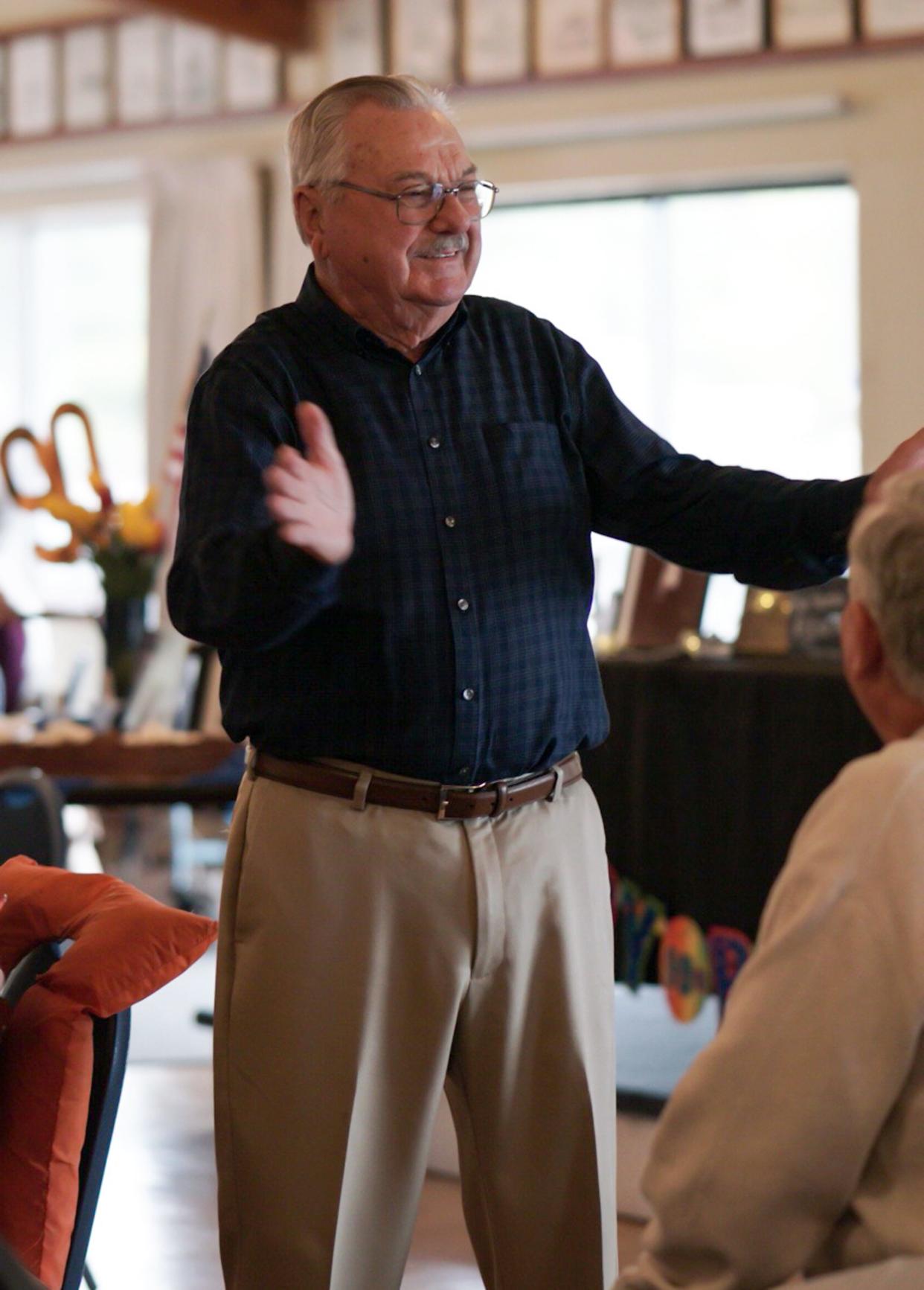 Dick Vlist, shown here speaking at his 90th birthday party, was passionate about the Navy, the community of Port Orchard, and cars, which he sold from the dealership he established on Bay Street in 1968. He died Aug. 22 at age 97.