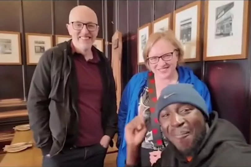 Idris Oyeniyi with the kind strangers who paidf for his meal in Glasgow's Café Gandolfi