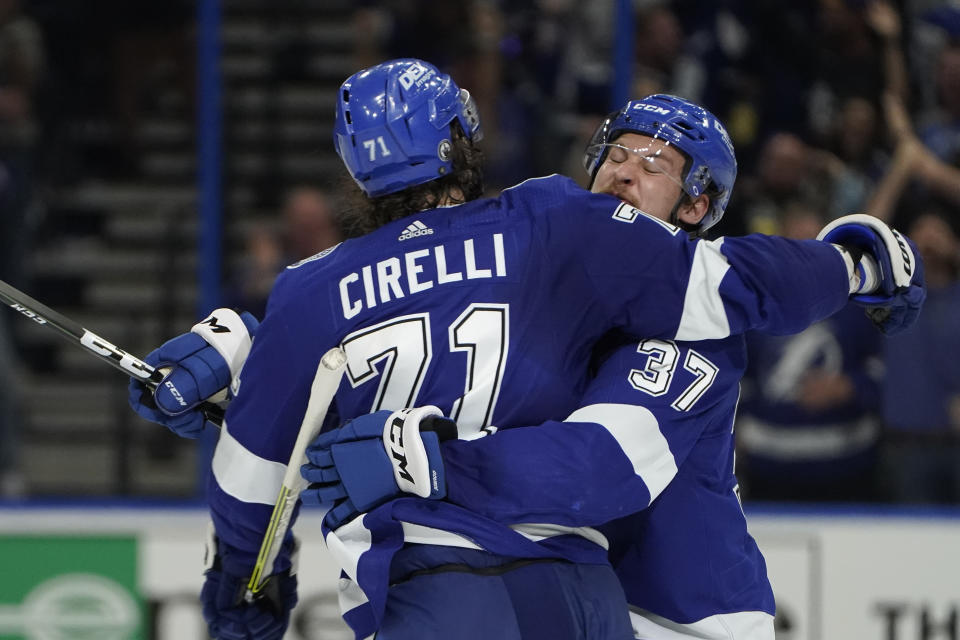 Tampa Bay Lightning center Yanni Gourde (37) celebrates with center Anthony Cirelli (71) after scoring a goal against the New York Islanders during the second period in Game 7 of an NHL hockey Stanley Cup semifinal playoff series Friday, June 25, 2021, in Tampa, Fla. (AP Photo/Chris O'Meara)