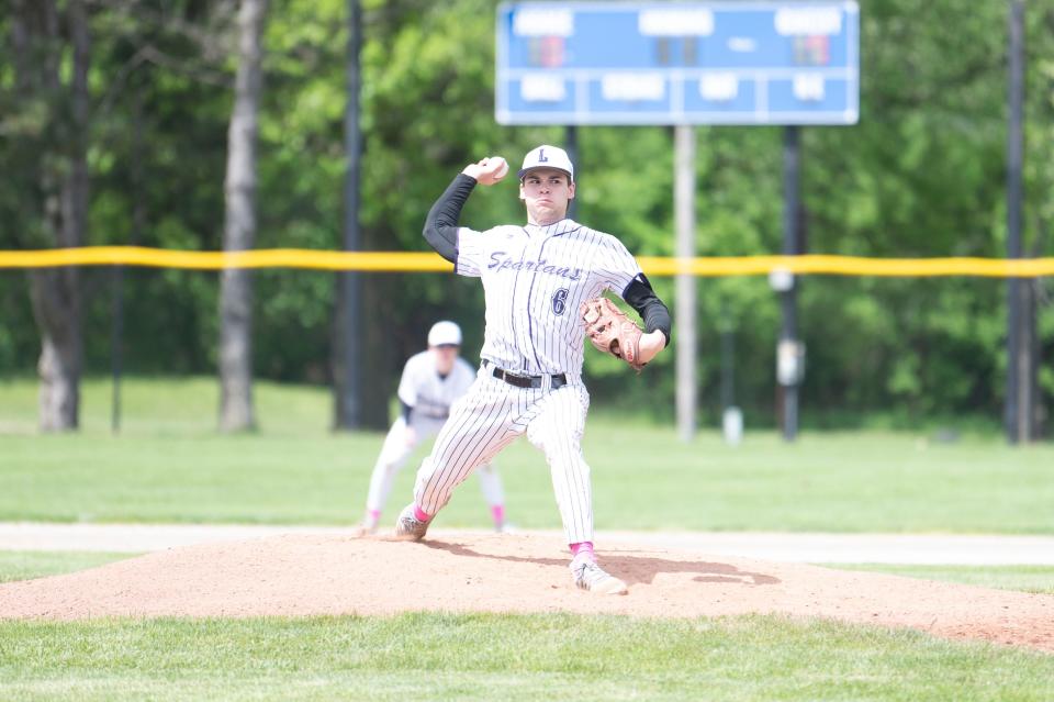 Lakeview senior Jake Kucharczyk pitches during the All-City final game against Harper Creek at Bailey Park on Saturday, May 11, 2024.