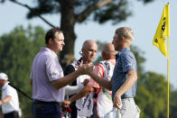 Will Zalatoris, right, greets Sepp Straka, of Austria, after defeating Straka in a playoff in the final round of the St. Jude Championship golf tournament, Sunday, Aug. 14, 2022, in Memphis, Tenn. (AP Photo/Mark Humphrey)