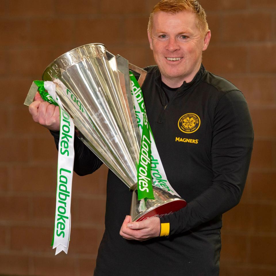 Manager Neil Lennon is pictured with the Ladbrokes Premiership trophy as Celtic are announced by the SPFL as title winners for the 2019/2020 season - SNS GROUP