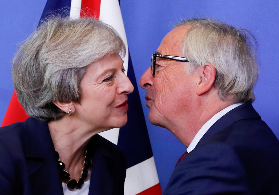 British Prime Minister Theresa May is welcomed by European Commission President Jean-Claude Juncker ahead of the European Union leaders summit in Brussels (Reuters)