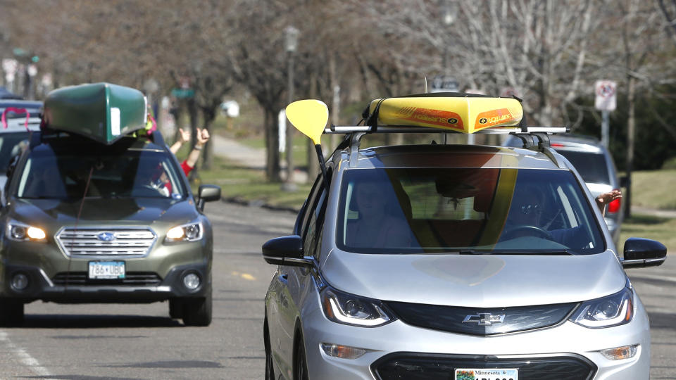 FILE - Supporters of the Campaign to Save the Boundary Waters drive past the residence of Minnesota Gov. Tim Walz as part of an Earth Day drive-in rally to Protect the Boundary Waters Canoe Area Wilderness on April 22, 2020, in St. Paul, Minn. The Biden administration moved Thursday, Jan. 26, 2023, to protect the pristine Boundary Waters Canoe Area Wilderness in northeastern Minnesota from future mining, dealing a potentially fatal blow to the proposed Twin Metals copper-nickel project. (AP Photo/Jim Mone, File)