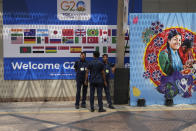 Security officers stand guard at the main venue of the G20 Summit, in New Delhi, India, Friday, Sept. 8, 2023. (AP Photo/Manish Swarup)
