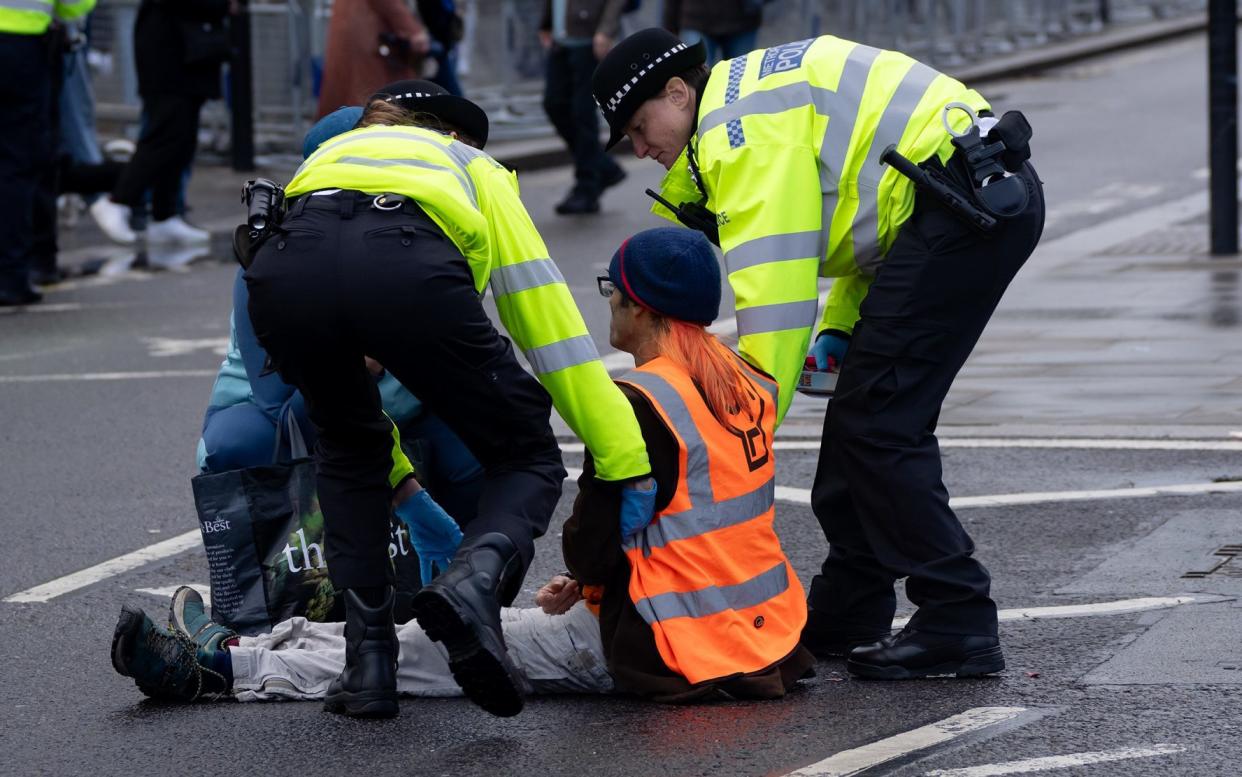 A protesters from the climate change group Just Stop Oil is arrested