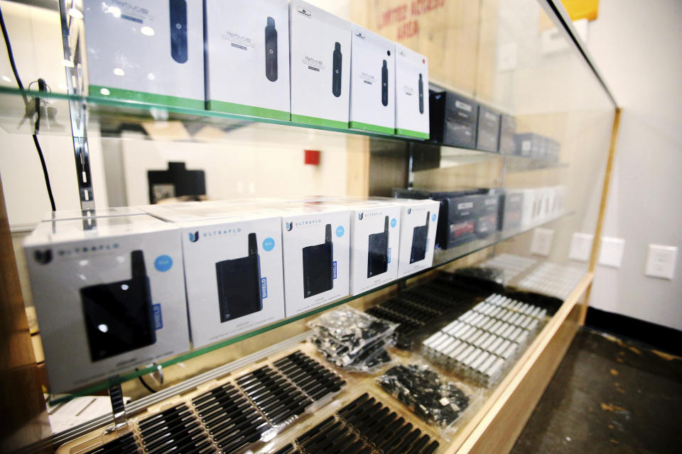 Items in display cases are available for purchase as Dragonfly Wellness in Salt Lake City prepares to open as the first of Utah's 14 medical cannabis pharmacies on Monday, March 2, 2020. (Scott G Winterton/The Deseret News via AP)