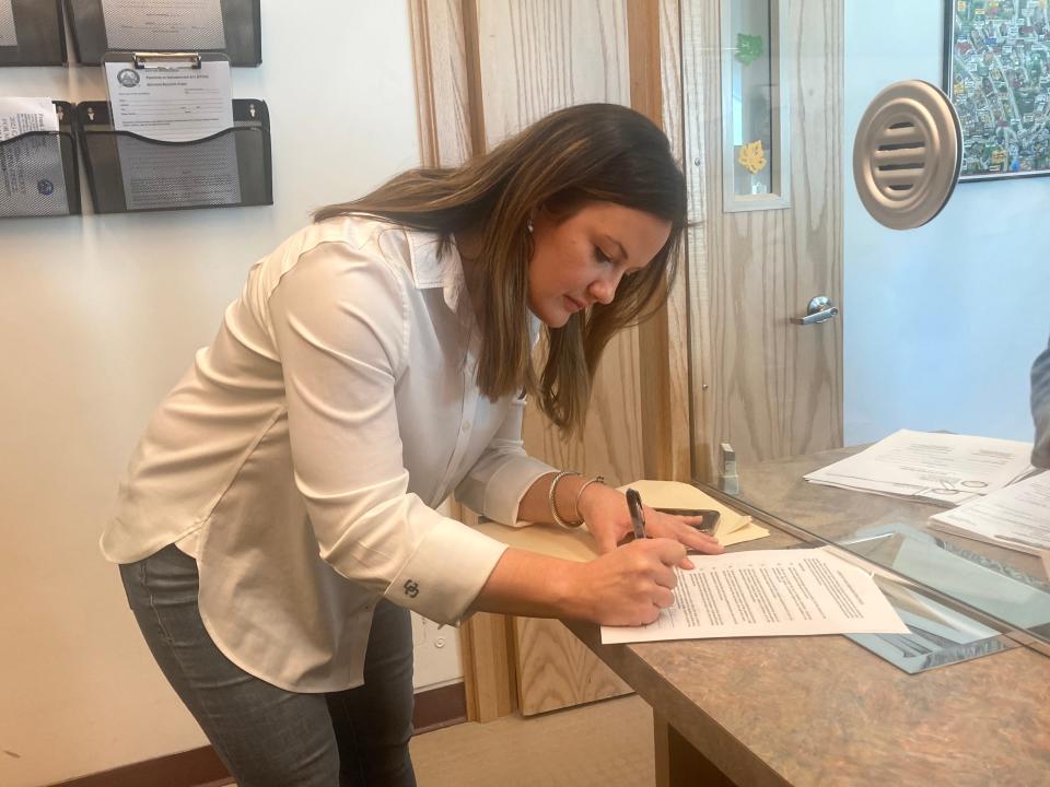 Ward 6 aldermanic candidate Alyssa Haaker signs paperwork as she files with the city clerk Monday for her 2023 run. Jennifer Notariano also filed in the race and Daniel Pittman has been circulating petitions. Candidates have until 5 p.m. on Nov. 28 to file for the Apr. 4 election.