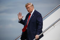 In this Sept. 26, 2019 photo, President Donald Trump waves to reporters as he steps off Air Force One after arriving at Andrews Air Force Base, in Andrews Air Force Base, Md. A whistle blew, an impeachment inquiry swung into motion and the president at the center of it all rose defiantly to his own defense, not always in command of the facts. (AP Photo/Evan Vucci)