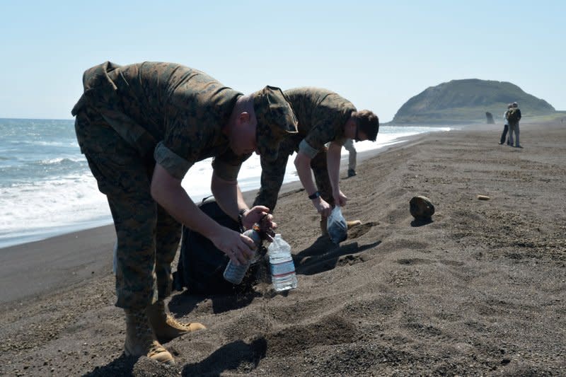 U.S. soldiers bring back the sand of the disembarkation beach at Iwo Jima, Japan, on March 19, 2016. On March 16, 1945, the Island was declared secure by U.S. forces in one of the major World War II conflicts in the Pacific. File Photo by Keizo Mori/UPI