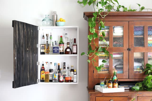 <p><a href="https://abeautifulmess.com/build-this-vintage-sign-inspired-liquor-cabinet/" data-component="link" data-source="inlineLink" data-type="externalLink" data-ordinal="1">A Beautiful Mess</a></p>