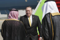 U.S. Secretary of State Mike Pompeo, centre, is greeted by Saudi Foreign Minister Adel al-Jubeir, after arriving in Riyadh, Saudi Arabia, Tuesday Oct. 16, 2018. Pompeo arrived Tuesday in Saudi Arabia for talks with King Salman over the unexplained disappearance and alleged slaying of Saudi writer Jamal Khashoggi, who vanished two weeks ago during a visit to the Saudi Consulate in Istanbul.(Leah Millis/Pool via AP)