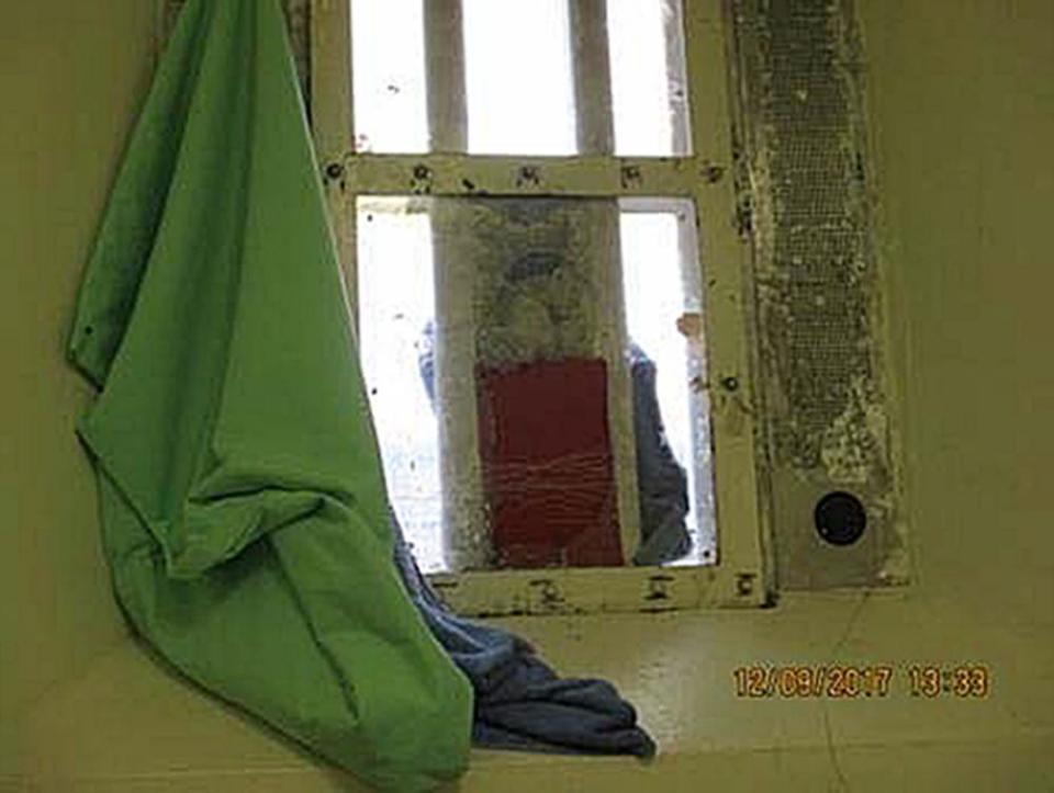 A broken window in a cell at HMP Liverpool.