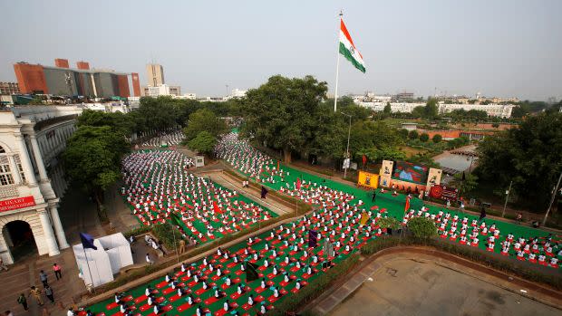 Participants perform yoga during World Yoga Day in New Delhi