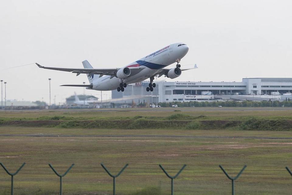 Plane spotting is a hobby of tracking the movement of aircraft often accomplished by photography. — Picture by Ahmad Zamzahuri