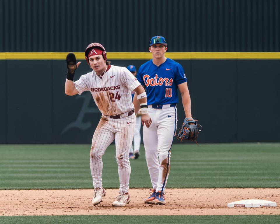 Arkansas baseball's Peyton Holt asks for time during the Razorbacks series against Florida. Since moving to the outfield, Holt has become an indispensable piece to Dave Van Horn's lineup.