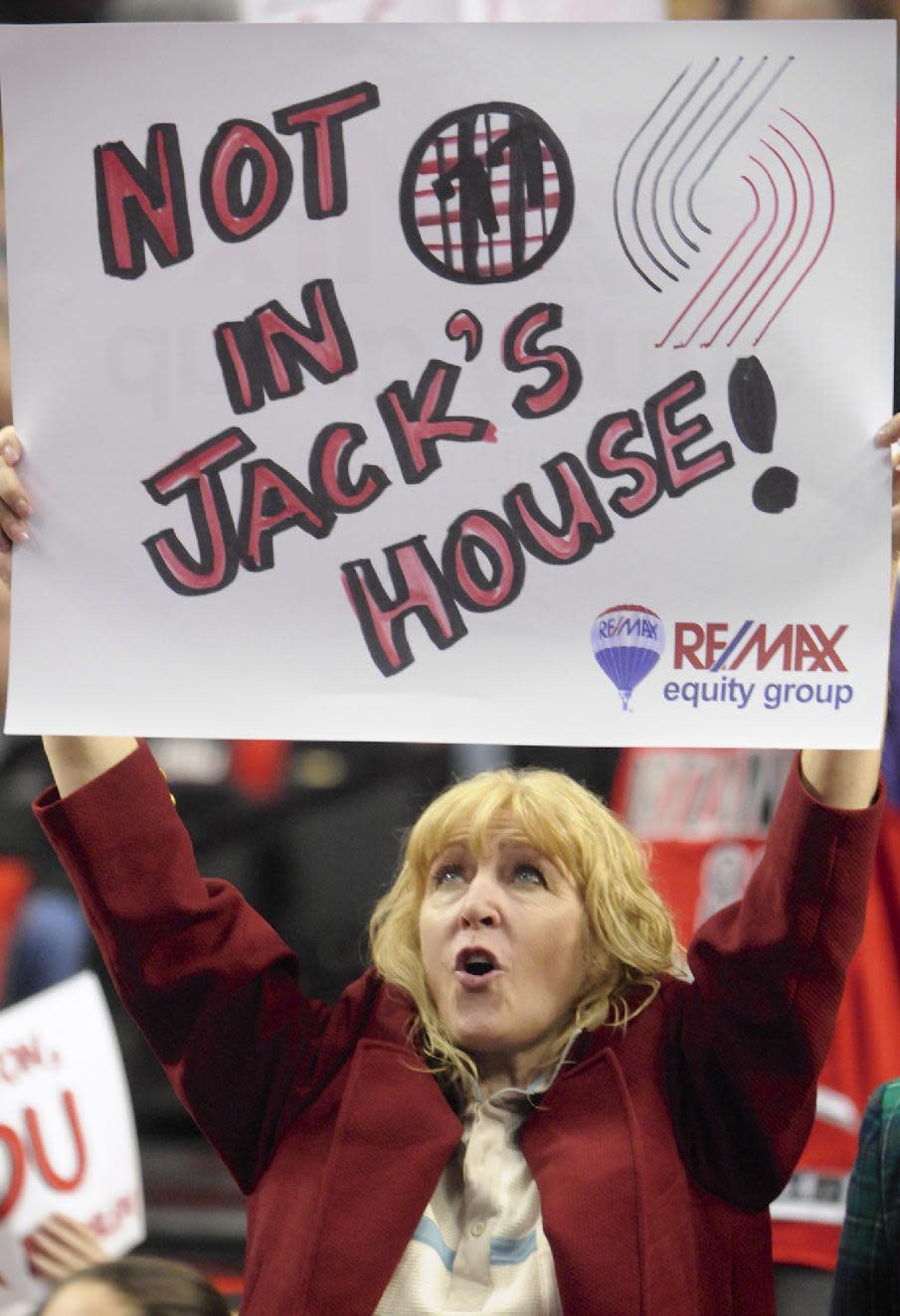 Portland Trail Blazers' fan Val Gaddy holds up a sign honoring former player and coach Jack Ramsay during the first half of game six of an NBA basketball first-round playoff series game in Portland, Ore., Friday May 2, 2014. (AP Photo/Greg Wahl-Stephens)