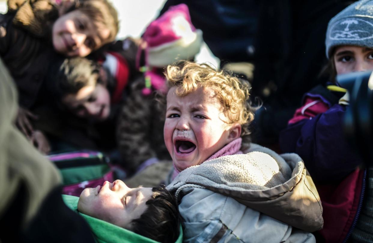 A child cries while fleeing the embattled northern city of Aleppo in 2016: AFP