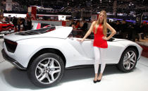 A model stands in front of the Italdesign Giugiaro Parcour at the 2013 Geneva Motor Show.