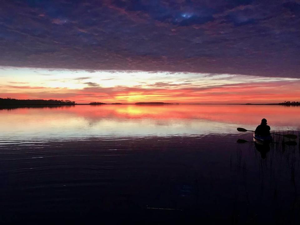 Dawn breaks over the Chechessee River, one of the many waterways that comprise Port Royal Sound. Here, kayaker James Brown of Bluffton enjoys the view. Port Royal Sound is the location of a new fishing tournament that’s designed to gather data on the fish that live there.