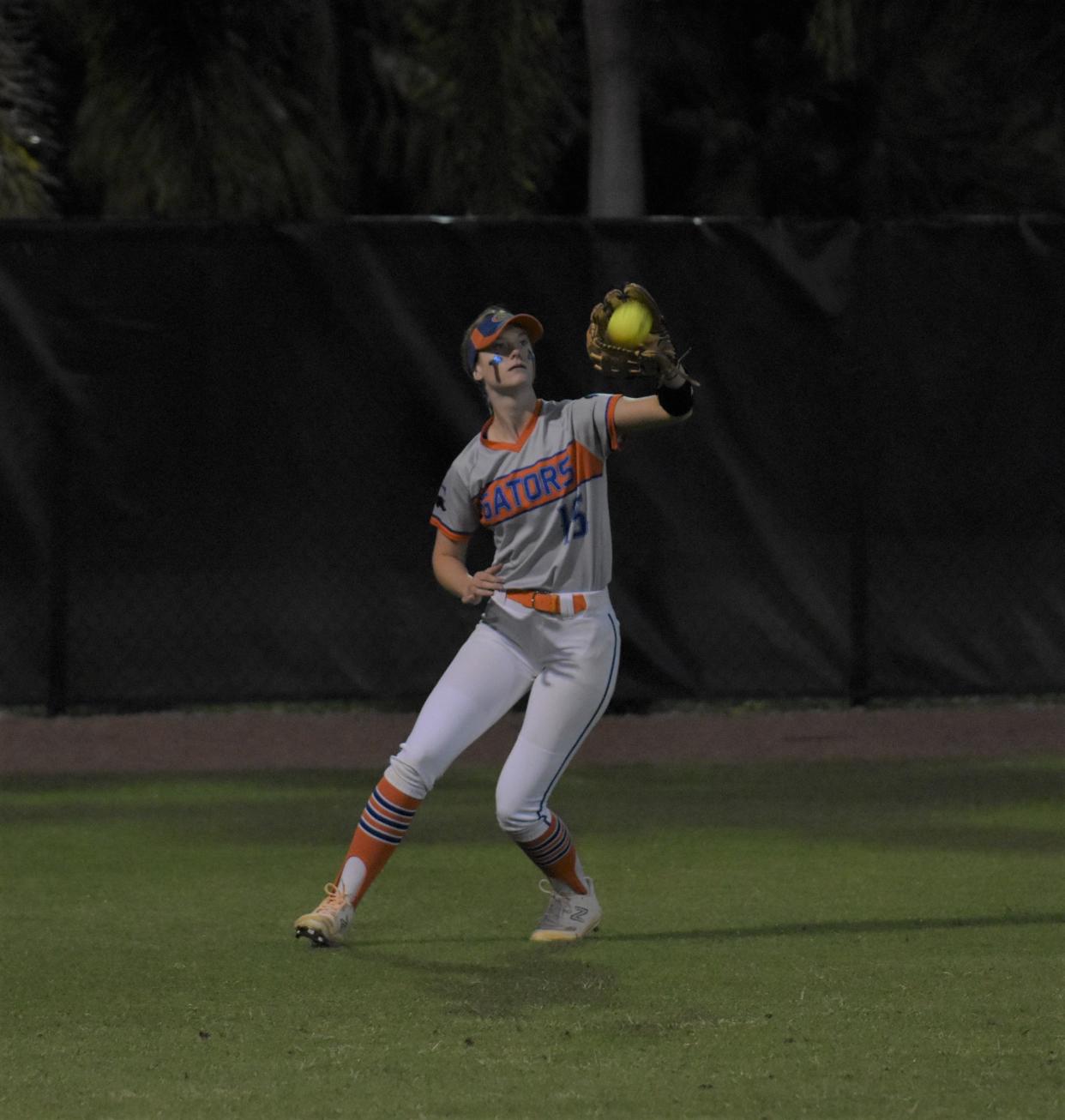 Palm Beach Gardens' Holly Frankl makes a catch in left field during a regular season game against Seminole Ridge on Mar. 27, 2024.