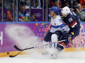 USA forward Blake Wheeler and Finland defenseman Sami Lepisto vie for the puck during the second period of the men's bronze medal ice hockey game at the 2014 Winter Olympics, Saturday, Feb. 22, 2014, in Sochi, Russia. (AP Photo/Petr David Josek)