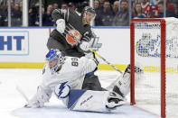 Tampa Bay Lightning goalie Andrei Vasilevskiy (88) reaches back to block a shot by Edmonton Oilers forward Connor McDavid (97) in the NHL hockey All Star final game Saturday, Jan. 25, 2020, in St. Louis. (AP Photo/Jeff Roberson)