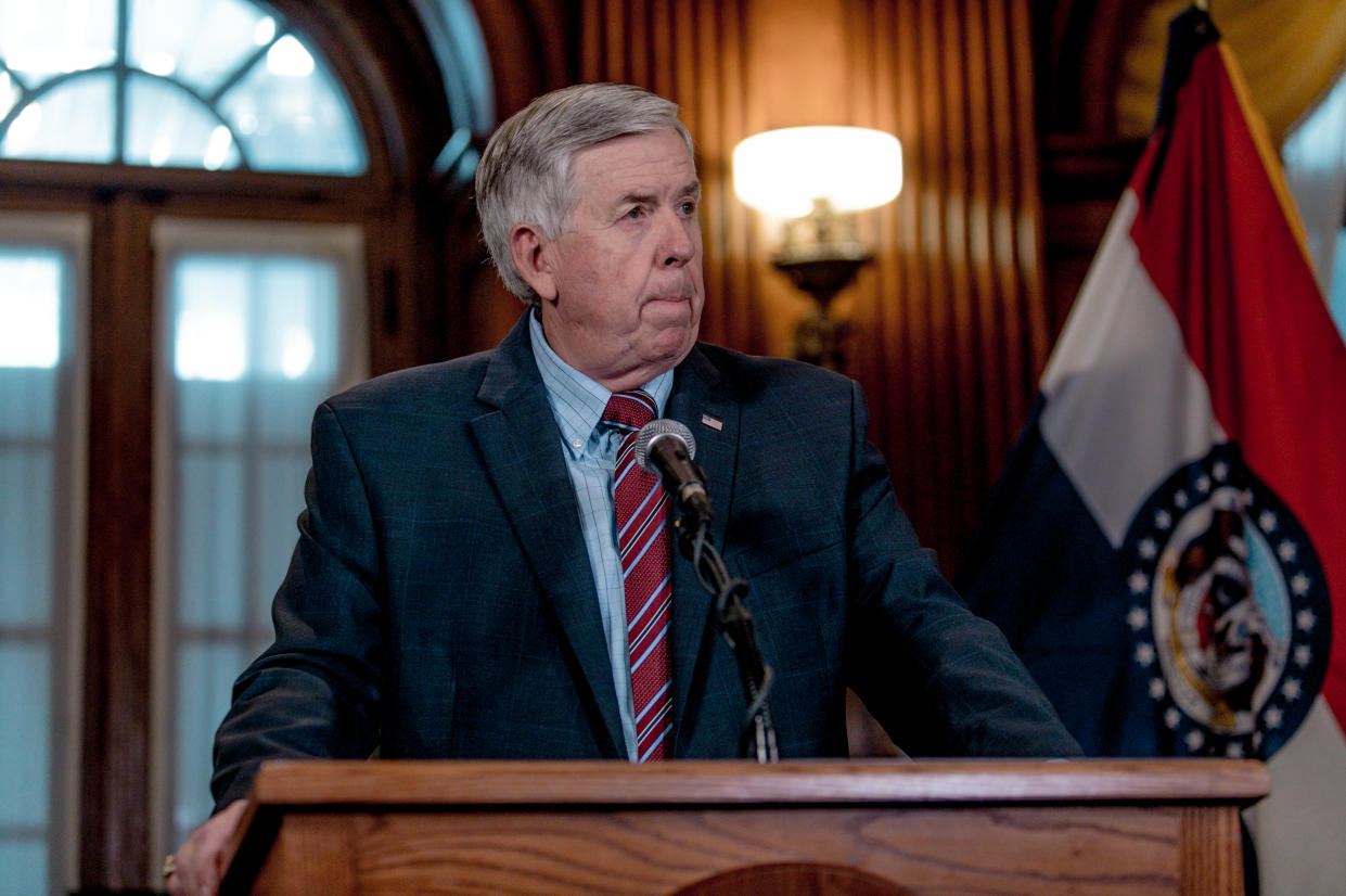 Gov. Mike Parson at the microphone.