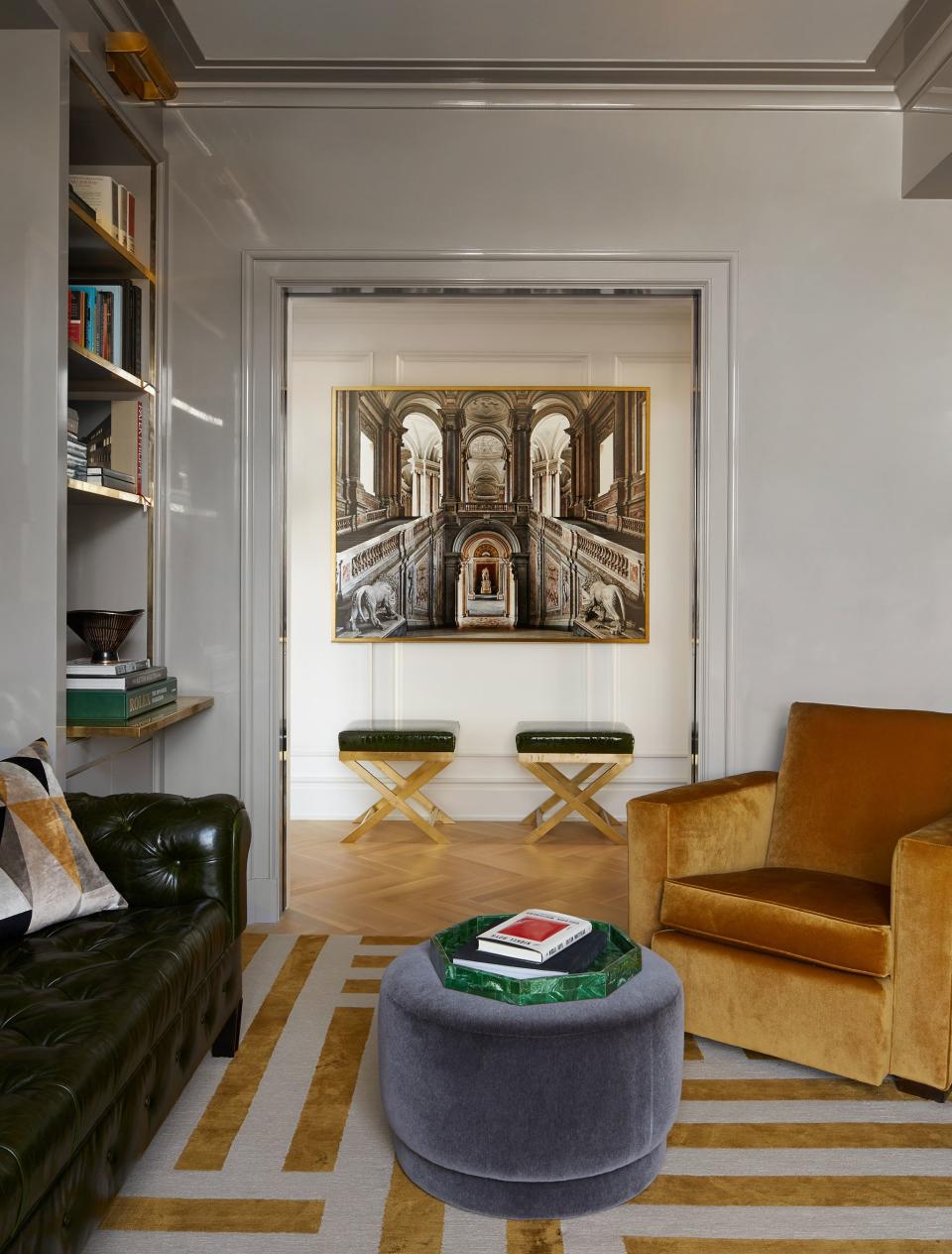 In the hallway outside the study, a work by Florentine photographer Massimo Listri hangs over a pair of circa 1960s Italian benches.