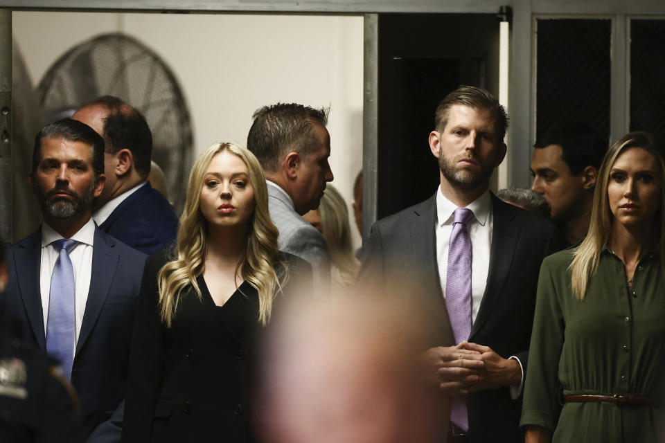 Eric Trump, Donald Trump Jr., and Lara Trump, look on, as former President Donald Trump arrives at Manhattan criminal court for closing arguments in his criminal hush money trial in New York, on Tuesday, May 28, 2024. (Andrew Kelly/Pool Photo via AP)