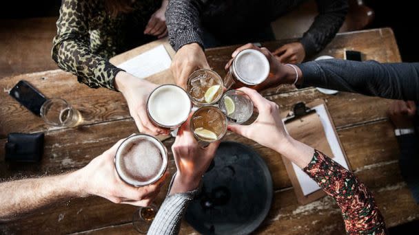 STOCK PHOTO: friends toast at a bar. (STOCK PHOTO/Getty Images)