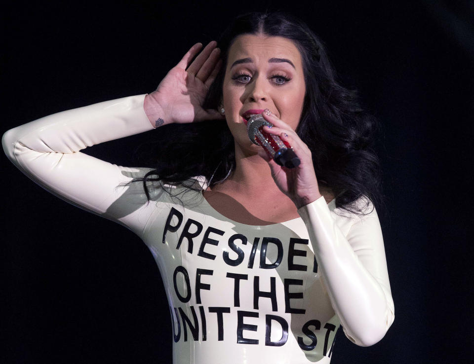 Singer Katy Perry performs for a crowd before the arrival of President Barack Obama at a campaign rally, Wednesday, Oct. 24, 2012, in Las Vegas. (AP Photo/Julie Jacobson)