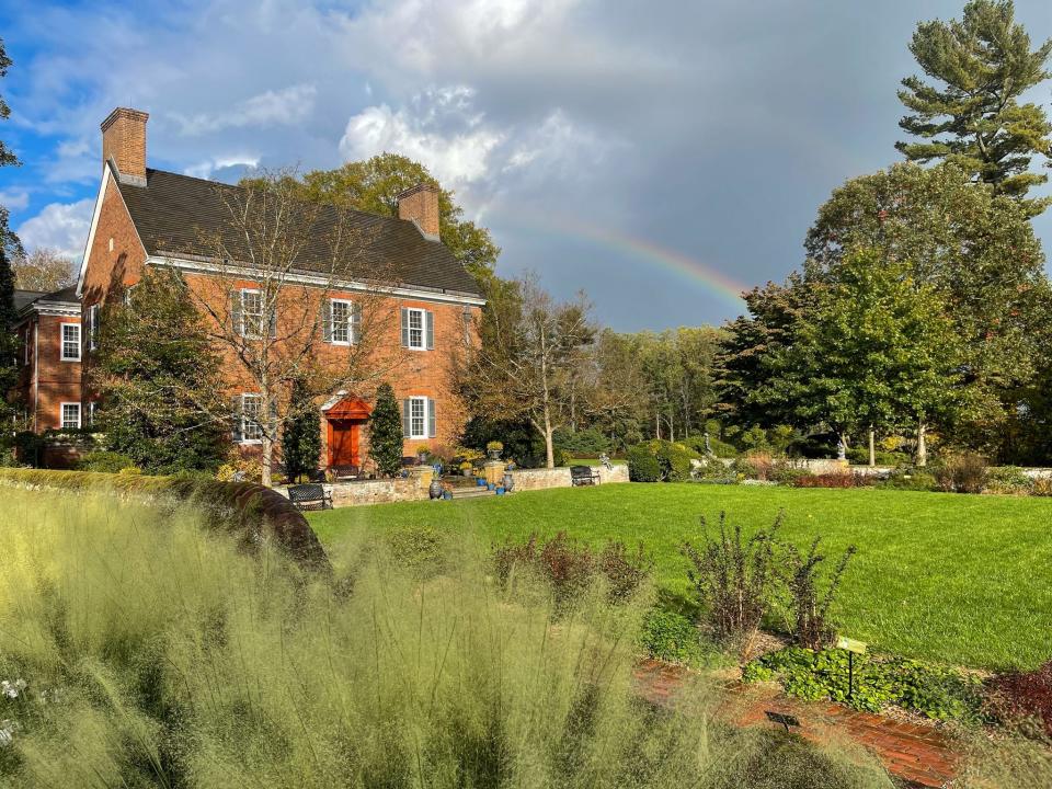 A rainbow appears after a brief shower on a fall afternoon at Mt. Cuba Center.