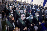 New judges and others attend a swearing-in ceremony before Egypt’s State Council, in Cairo, Egypt, Tuesday, Oct. 19, 2021. Ninety eight women have become the first female judges to join the council, one of the country’s main judicial bodies. The swearing-in came months after President Abdel Fattah el-Sissi asked for women to join the State Council and the Public Prosecution, the two judicial bodies that until recently were exclusively male. (AP Photo/Tarek Wajeh)