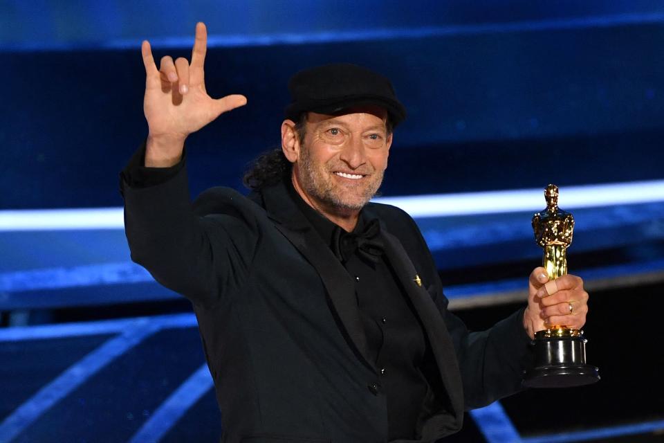 US actor Troy Kotsur accepts the award for Best Actor in a Supporting Role for "CODA" onstage during the 94th Oscars at the Dolby Theatre in Hollywood, California on March 27, 2022.