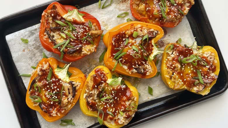 korean stuffed bell peppers with egg and gochujang on baking sheet