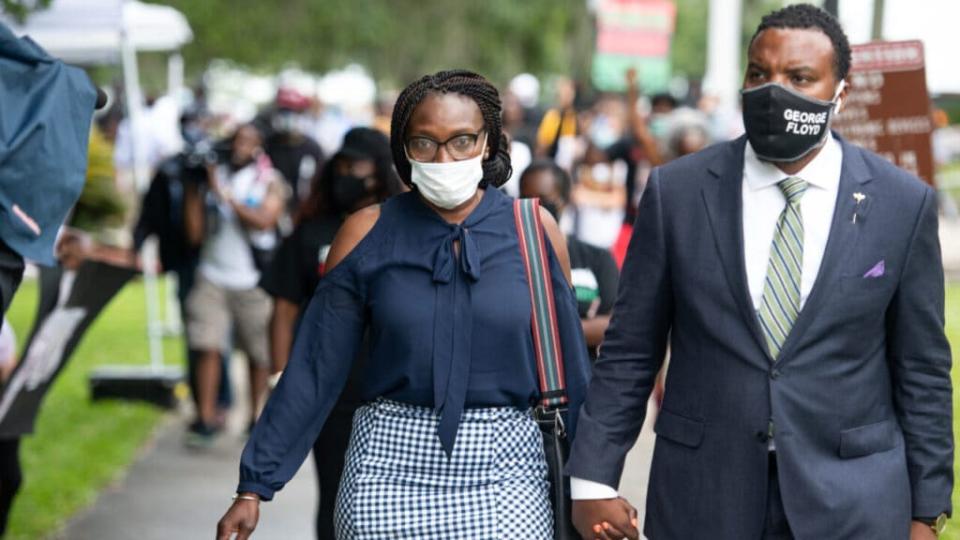 Wanda Cooper, left, mother of Ahmaud Arbery, and attorney Lee Merritt, leave the Glynn County courthouse during a court appearance by Gregory and Travis McMichael, two suspects in the fatal shooting of Ahmaud Arbery, on June 4, 2020 in Brunswick, Georgia. Arbery was killed on February 23. (Photo by Sean Rayford/Getty Images)