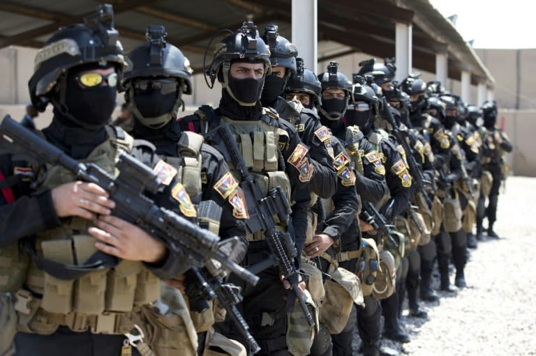Iraqi Counter Terrorism Service forces participate in a training exercise watched by US Defence Secretary Ashton Carter at the Baghdad Airport complex on July 23, 2015