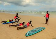 Wider Image: Meet Senegal's first female pro surfer inspiring girls to take to the waves