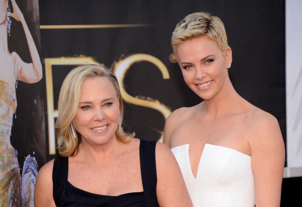 Charlize Theron (right) with her mother, Gerda, at the Oscars in 2013. (Photo: Kevin Mazur via Getty Images)