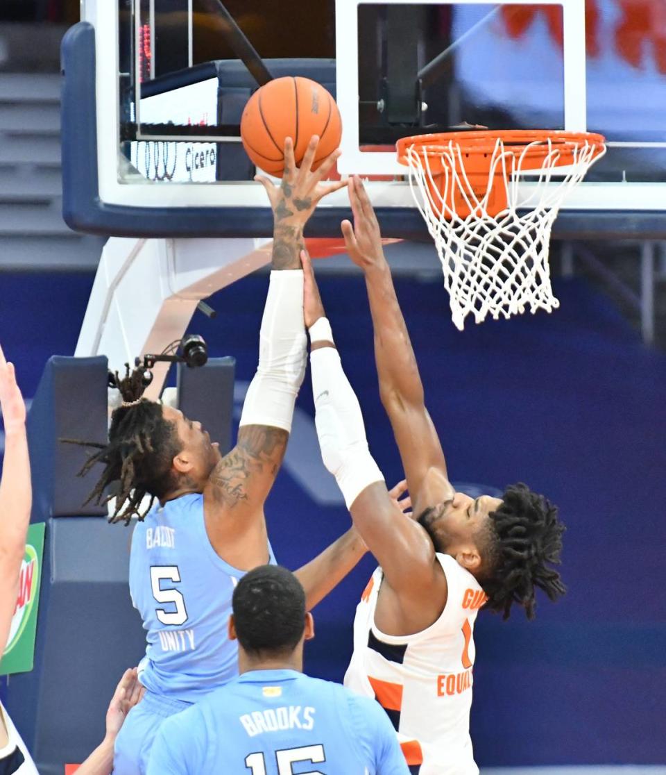 North Carolina Tar Heels forward Armando Bacot (5) shoots over Syracuse Orange forward Quincy Guerrier (1) in the first half at the Carrier Dome.