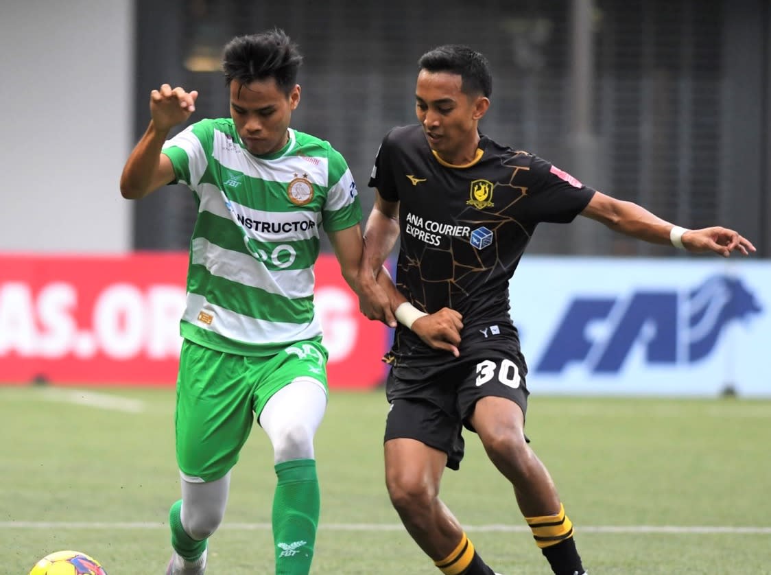 Geylang's Syahir Sahimi (left) and Tampines' Faris Ramli tussle for the ball during their Singapore Premier League match at Our Tampines Hub. (PHOTO: SPL)